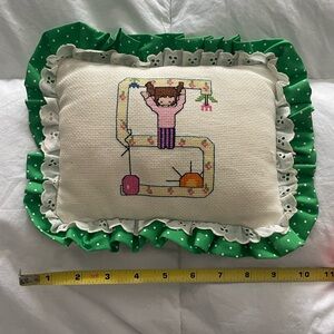 Embroidered Pillow with Green Ruffle